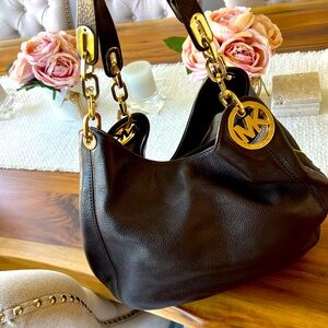 Michael Kors handbag with gold emblem. All leather, supple feel.